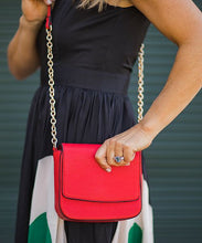 Load image into Gallery viewer, The Red Gemma Bag is an eye catching bag with it&#39;s structured body and chain feature.   A striking outfit addition that will carry your essentials on a special night out.     Features:  1 Zip Pockets 1 Card Slot Internal lining - Black/White Stripe Strap: Chain Feature Closure: Magnetic Clasp Material: Vegan Leather  Hardware: Light Gold  Dimensions: W18 x H16.5 x D6 cm
