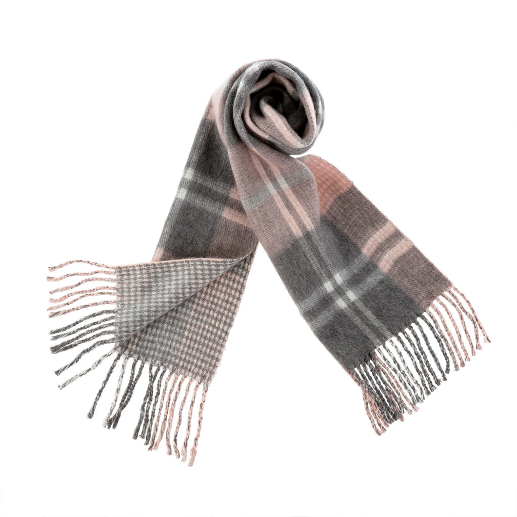 A staple on chilly days this fringed blanket scarf will have you bundling up with tried-and-true style. A soft brushed woven blend of acrylic polyester and wool you won't want to take them off all season.  Materials:  ACRYLIC POLYESTER WOOL Dimensions: 72 x 12