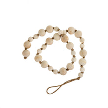 Load image into Gallery viewer, A simple must have coffee table styling piece, these wooden beads add a touch of feel-good style to your living space. Inspired by Mala beads used for prayer and meditation, they encourage mindfulness, peace, and clarity. Dimensions: 36&quot;L x 1&quot;W x 1&quot;H  Materials: Paulownia Wood, Jute rope - Carved from paulownia wood and finished with a natural wash
