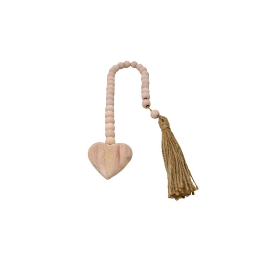 This pink wooden heart garland makes a beautiful addition to your home décor.  Trendy and fun, they can be placed anywhere.  Have it spilling onto your coffee table with one of our candles, or hang them from a book shelf or chair to show off the adorning tassle.  They are also a perfect gift for new babies, newlyweds or a wonderful hostess.    Dimensions: 5 X 1.5 X 46 CM
