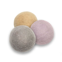 Load image into Gallery viewer, Change your laundry forever with this multi-colour set of reusable dryer balls.  Ethically-made and eco-friendly, these alpaca dryer balls are a natural and sustainable alternative to your never-ending supply of dryer sheets.  The balls absorb moisture and create air circulation in the dryer. This wind effect in the dryer reduces dryer time. At the same time, the balls replace disposable dryer sheets and plastic dryer balls along with the harsh chemicals within them.
