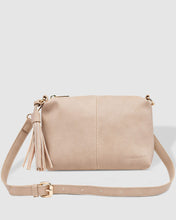Load image into Gallery viewer, The Baby Daisy Putty Crossbody is a small, unstructured body style bag, with a relaxed look and tassel detail for some fun and spark.  It&#39;s just the right size and feels so soft.  For travel or work, throw Baby Daisy in your larger tote and be ready for anything.  Features:  1 x Zip Pocket 2 x Flat Pockets Internal lining - Black/White Stripe Extension strap: 110cm Adjustable Detachable Closure: Secure Zip Material: Vegan Leather  Hardware: Light Gold  Dimensions: W25 x H16 x D6 cm
