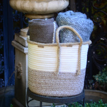 Load image into Gallery viewer, Large woven braided basket - 10.5&quot; diameter.  Shown with 2 wool blankets inside
