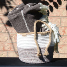 Load image into Gallery viewer, Small woven braided basket - 8&quot; diameter. Shown with wool blanket inside

