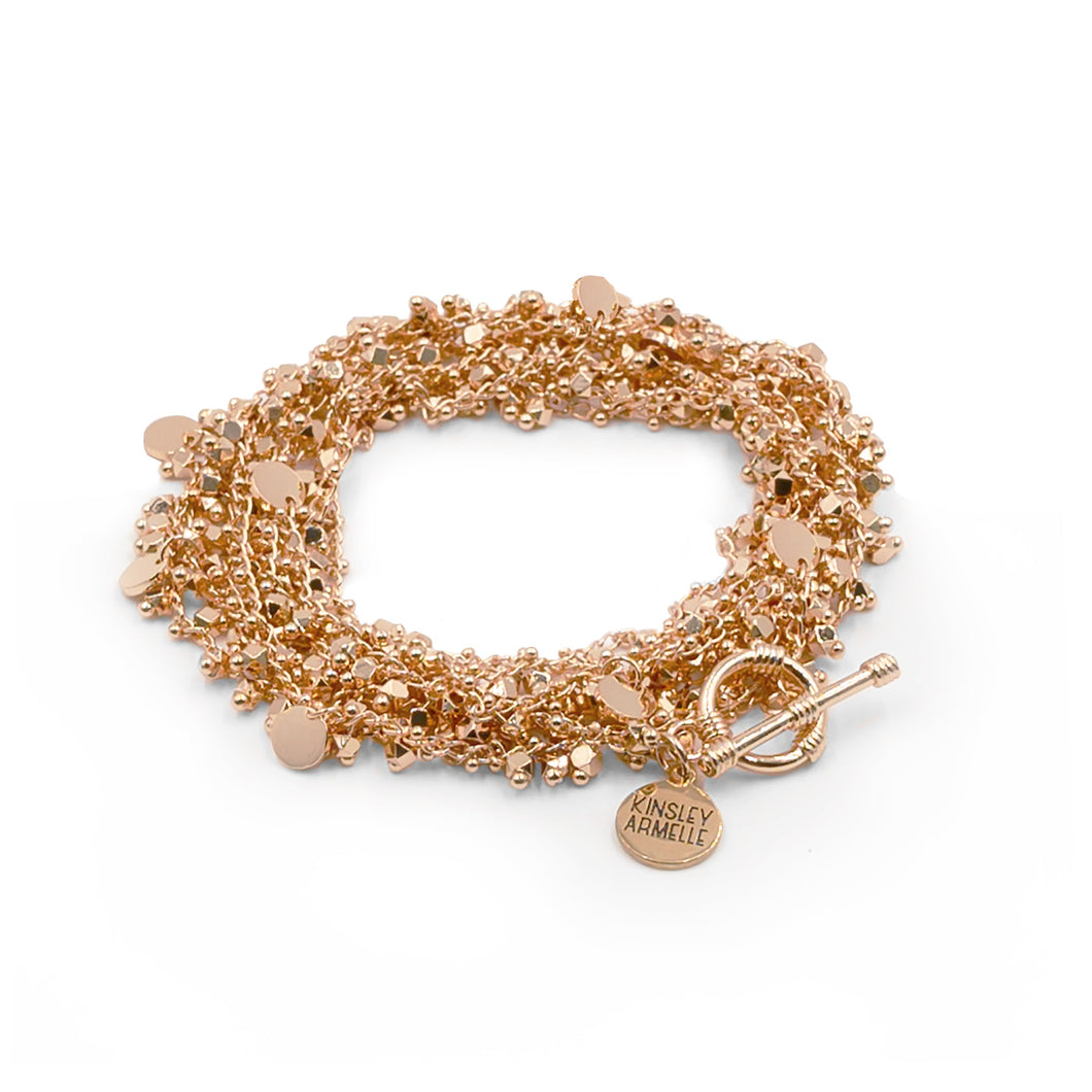 The Maya Rose Gold Wrap Bracelet/Necklace brings the party right to you. This piece allows you to wear your piece as a wrapped bracelet or a layered necklace, making this a wonderful piece to add versatility to your collection. We know you will love the Maya Wrap. Exclusively from Kinsley Armelle.  Details:  18K Rose Gold Ion Plated Stainless Steel 5 - 8.5 Inches Circumference / 56 Inches Length. Shown as a bracelet