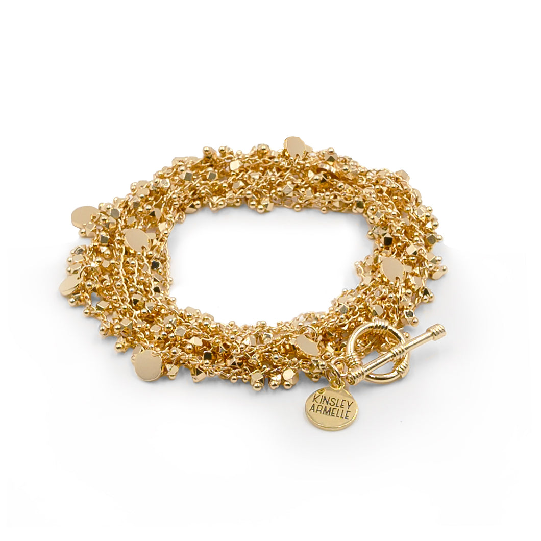 The Maya Gold Wrap Bracelet/Necklace brings the party right to you. This piece allows you to wear your piece as a wrapped bracelet or a layered necklace, making this a wonderful piece to add versatility to your collection. We know you will love the Maya Wrap, Exclusively from Kinsley Armelle.  Details:  18K Yellow Gold Ion Plated Stainless Steel 5 - 8.5 Inches Circumference / 56 Inches Length. Shown as a bracelet