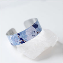 Load image into Gallery viewer, We have picked some of our favourite pieces and paired them with an inspirational saying that resonates with us. We know you will love this piece as much as we do.   Quote inside:  &quot;Life is a story. Write well. Edit often.&quot;  Made of aluminum each cuff is hypo-allergenic, lead and nickel free, with no toxic finishes. Everything is printed with a permanent dye which gives a nice vibrant finish.   Cuffs are super light weight and adjustable allowing them to be molded to fit most sizes.   Each cuff is 3/4&quot; thic
