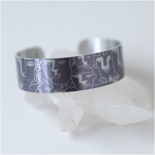 Load image into Gallery viewer, We have picked some of our favourite pieces and paired them with an inspirational saying that resonates with us. We know you will love this piece as much as we do.   Quote inside:  &quot;Well behaved women seldom make history.&quot;  Made of aluminum each cuff is hypo-allergenic, lead and nickel free, with no toxic finishes. Everything is printed with a permanent dye which gives a nice vibrant finish.   Cuffs are super light weight and adjustable allowing them to be molded to fit most sizes.   Each cuff is 3/4&quot; thick
