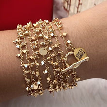 Load image into Gallery viewer, The Maya Rose Gold Wrap Bracelet/Necklace brings the party right to you. This piece allows you to wear your piece as a wrapped bracelet or a layered necklace, making this a wonderful piece to add versatility to your collection. We know you will love the Maya Wrap. Exclusively from Kinsley Armelle.  Details:  18K Rose Gold Ion Plated Stainless Steel 5 - 8.5 Inches Circumference / 56 Inches Length. Shown worn by person as a bracelet
