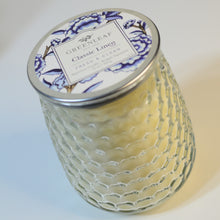 Load image into Gallery viewer, Made from a lovely dimpled surface glass, this beautiful candle is topped with a metal lid to protect it from dust or damage, helping them last longer.  Classic Linen Scent
