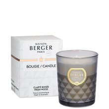 Load image into Gallery viewer, The Clarity Glass Candle is a strong Fresh Wood fragrance which evokes summer thanks to its marine notes but also thanks to its floral scents of lavender and the powerful smell of cedarwood, for a fresh, masculine and aromatic moment! Product Details: 100% natural botanical and vegan wax (soy), without GMOs, Green and sustainable artisanal manufacturing Fragrances created by French master perfumers, Patented molecule to neutralize bad odors Intense perfuming for up to 30 hours 180 grams
