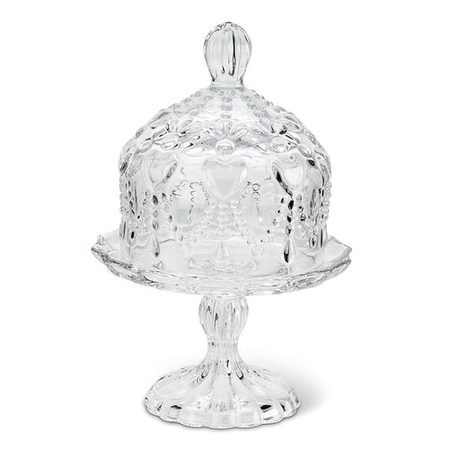 A delicate, pressed clear glass pedestal plate with dainty hearts and a matching cover for special treats.  Perfect for any dessert table.  Size:  6.5