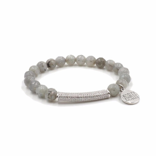 The Haze Glitz Beaded Bracelet in Silver is an absolute stunner because of the rhinestone paved bar nestled between stone beads. Each rhinestone paved bar is plated in silver and will stand the test of time for your collection. This bracelet is also great to stack with other bracelets to really bring an exquisite look all together. Exclusively from Kinsley Armelle.   Details:  Style: Beaded Material: Labradorite + Rhinestones Size: 6.5 - 8 Inch Circumference