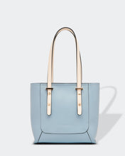 Load image into Gallery viewer, Small, sweet and on-trend!  This gorgeous Pale Blue Hazel Handbag screams Audrey Hepburn!!  Such a classic style and easy to carry, this perfectly sized handbag has more than enough room for all your essentials.  Features:  1 x Phone Pocket 1 Flat Pocket Feet on base Internal lining Strap Height: 20cm Extension strap: 110cm Adjustable Detachable Closure: Secure Zip Material: Vegan Leather  Hardware: Light Gold  Dimensions: W22 x H21 x D8 cm

