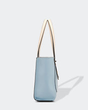 Load image into Gallery viewer, Small, sweet and on-trend!  This gorgeous Pale Blue Hazel Handbag screams Audrey Hepburn!!  Such a classic style and easy to carry, this perfectly sized handbag has more than enough room for all your essentials.  Features:  1 x Phone Pocket 1 Flat Pocket Feet on base Internal lining Strap Height: 20cm Extension strap: 110cm Adjustable Detachable Closure: Secure Zip Material: Vegan Leather  Hardware: Light Gold  Dimensions: W22 x H21 x D8 cm
