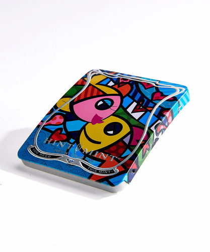 the patented Hint Mint Curved Tin features artwork from Iconic Pop artist Romero Britto. The tin features Britto's popular Deeply in Love Design and showcases his signature use of vivid color and bold graphics.  These Hint Mint Tins are sleek and contemporary and can be reused as a chic credit card case.  Made with 100% natural pomegranate flavor and organic acai juice.  35 mints