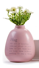 Load image into Gallery viewer, HUG - The act of holding someone close in your arms to let them know you love them without needing to say a thing.  This mini bud vase says it all!  Show them how much you love them.  Dimensions: 4&quot;H x 3&quot;Diameter
