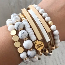 Load image into Gallery viewer, The Pepper Farrah Beaded Bracelet is comprised of White Howlite stone beads spaced evenly with decorative gold embellishment beads. This bracelet is a must have to compliment any outfit, and goes perfectly with other bracelets featured as part of the Lennox Stack. Exclusively from Kinsley Armelle.  Details:  Style: Beaded Material: White Howlite and Metal Size: 6.5 - 7 Inch Circumference. Shown: Lennox Stack

