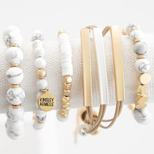 Load image into Gallery viewer, Layering different bracelets together has never been easier than with the Lennox Bracelet Stack. For an everyday staple or a night out on the town, these simple yet elegant bracelets pair perfectly together. Exclusively from Kinsley Armelle.  Click on each bracelet for a description of each.  The Lennox Bracelet Stack Includes:  Pepper Keystone Bracelet Hybrid Metallic Bracelet Ashen Livia Bracelet Pepper Farrah Bracelet Pepper Amari Bracelet
