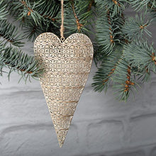 Load image into Gallery viewer, This stunning gold metal heart ornament will be the perfect accompaniment to any seasonal decor.  Large and beautiful, this sparkly gold ornament will compliment any tree.  Size:  7 x 3.5&quot;  Material:  Metal
