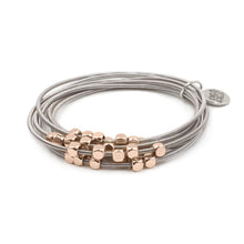 Load image into Gallery viewer, The Ory Metallic Chain Bracelet in Rose Gold is a combination of stacks that includes metallic alloys with rose gold bead embellishments. The bracelet provides a light weight option to mix and match silver and rose gold metals. This bracelet is stunning  alone, but you can also stack it with other bracelets in the Lainey Stack for an even more coordinated look. Exclusively from Kinsley Armelle.   Details:  Style: Stretch Material: Steel + Metal Size: 6.5 - 8 Inch Circumference

