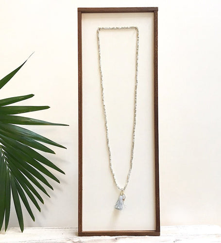 There is no such thing as too many pieces of jewelry, especially sparkly ones with flowing tassels.  Adorn your neck with the latest layered look.  *Paired in picture with the Triptych Necklace  Details:  Swarovski crystal beads strung on elastic Wire-wrapped druzy charm 1.5