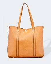 Load image into Gallery viewer, The Nutmeg Nevada Bag is a great tote style which can double as a laptop or work bag. Featuring a luxurious suedette lining, this shoulder bag is spacious and functional with enough room to carry all your essentials and more! Features: 2 Slip Pockets 1 Zip Pocket Feet on Base Internal Lining: Suedette Strap: Height 25cm Extension Strap: Detachable Webbing 41cm Magnetic Clasp Material: Vegan Leather Hardware: Light Gold Dimensions: H31 x W41 x D11 cm
