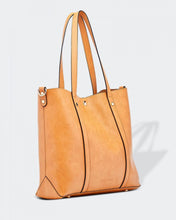 Load image into Gallery viewer, The Nutmeg Nevada Bag is a great tote style which can double as a laptop or work bag. Featuring a luxurious suedette lining, this shoulder bag is spacious and functional with enough room to carry all your essentials and more! Features: 2 Slip Pockets 1 Zip Pocket Feet on Base Internal Lining: Suedette Strap: Height 25cm Extension Strap: Detachable Webbing 41cm Magnetic Clasp Material: Vegan Leather Hardware: Light Gold Dimensions: H31 x W41 x D11 cm
