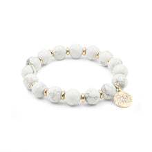 Load image into Gallery viewer, The Pepper Farrah Beaded Bracelet is comprised of White Howlite stone beads spaced evenly with decorative gold embellishment beads. This bracelet is a must have to compliment any outfit, and goes perfectly with other bracelets featured as part of the Lennox Stack. Exclusively from Kinsley Armelle.  Details:  Style: Beaded Material: White Howlite and Metal Size: 6.5 - 7 Inch Circumference
