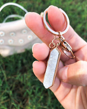 Load image into Gallery viewer, This Quartz Bangle Keychain features dual raw quartz stones on a smooth rose gold ion-plated stainless steel pendant. The stones are rigid rocks to add that extra flare to your style. Exclusively from Kinsley Armelle.   Details:  Material: 18K Rose Gold Ion Plated Stainless Steel Size: 3 Inch Long
