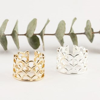 Delicate yet bold. Beautiful scallops reminiscent of the sea in a great modern look.  Details:  gold or silver plate Adjustable Hypoallergenic Nickel/lead free 3 coats anti-tarnish   