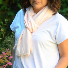 Load image into Gallery viewer, Add a bit of glamour to your wardrobe with this ideal multi-seasonal pashmina. Scarves are an important accessory and a definite must have in any wardrobe, and a fringe pashmina is the ideal cover-up for your favourite activity.  4 colours to choose from:  Blush Black Off-White Rose 75&quot; L x 31.5&quot; W 100% Viscose Machine Washable. Shown: Person wearing Blush scarf
