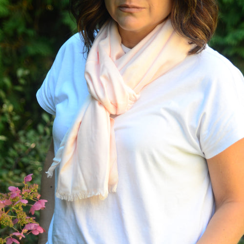 Add a bit of glamour to your wardrobe with this ideal multi-seasonal pashmina. Scarves are an important accessory and a definite must have in any wardrobe, and a fringe pashmina is the ideal cover-up for your favourite activity.  4 colours to choose from:  Blush Black Off-White Rose 75