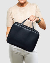 Load image into Gallery viewer, The Black Emma hanging toiletry case is the perfect travel companion with waterproof sealed compartments and a hook for convenient hanging.     Pair it with the Bardot cosmetic case for an Exclusive Bundle!  Internal Features:  Hanging Hook with Zip Compartment 2 Zip Pockets Lining: Black/White Stripe External Features:  Black Zip Pocket Secure Zip Material: Vegan Leather  Hardware: Silver  Dimensions: H21 x W28 x D9 cm
