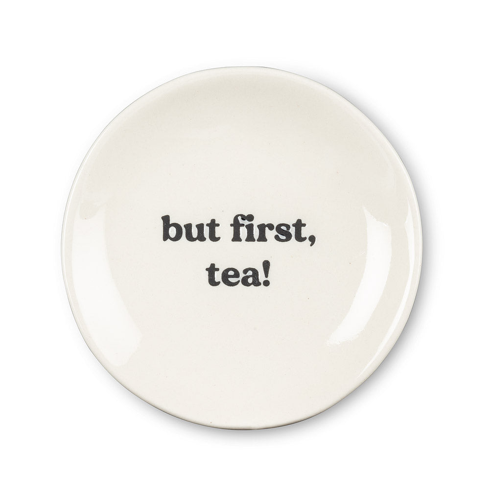 Get your priorities in order with the help of this “But First, Tea” Small Plate. Crafted out of stoneware with a glossy ivory finish, this plate is the perfect size for tea bags or your favourite tea-time treats.   Pair it with any of our tea sets for a perfect gift.  Size:  3.5