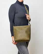 Load image into Gallery viewer, The Charlie Maxi bag is slightly larger then the Charlie bag still with an irresistible boxy shape.  Slip your essentials into the spacious and soft suedette interior or two slip pockets.  Style it your way with your choice of two varying size straps.  The perfect everyday bag.  Features:  2 Flat Pockets 1 Front Side Zip Pocket Internal lining - Suedette Vegan Leather 2 Straps: 50cm &amp; 110cm Closure: Secure Zip Material: Polyurethane PU  Hardware: Light Gold  Dimensions: W33 x H30 x D10.5 cm
