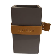 Load image into Gallery viewer, Sleek and stylish, this cute pen holder isn&#39;t just for pens.  You can use it for virtually anything!  With a beautiful &quot;Just Love&quot; sentiment, perfect for the home office, kitchen counters and bathrooms.    Size:  2.5&quot; W x 4.5&quot; H x 2.5&quot; D  Material: Cement/Leather Strap  **Spot Clean Only
