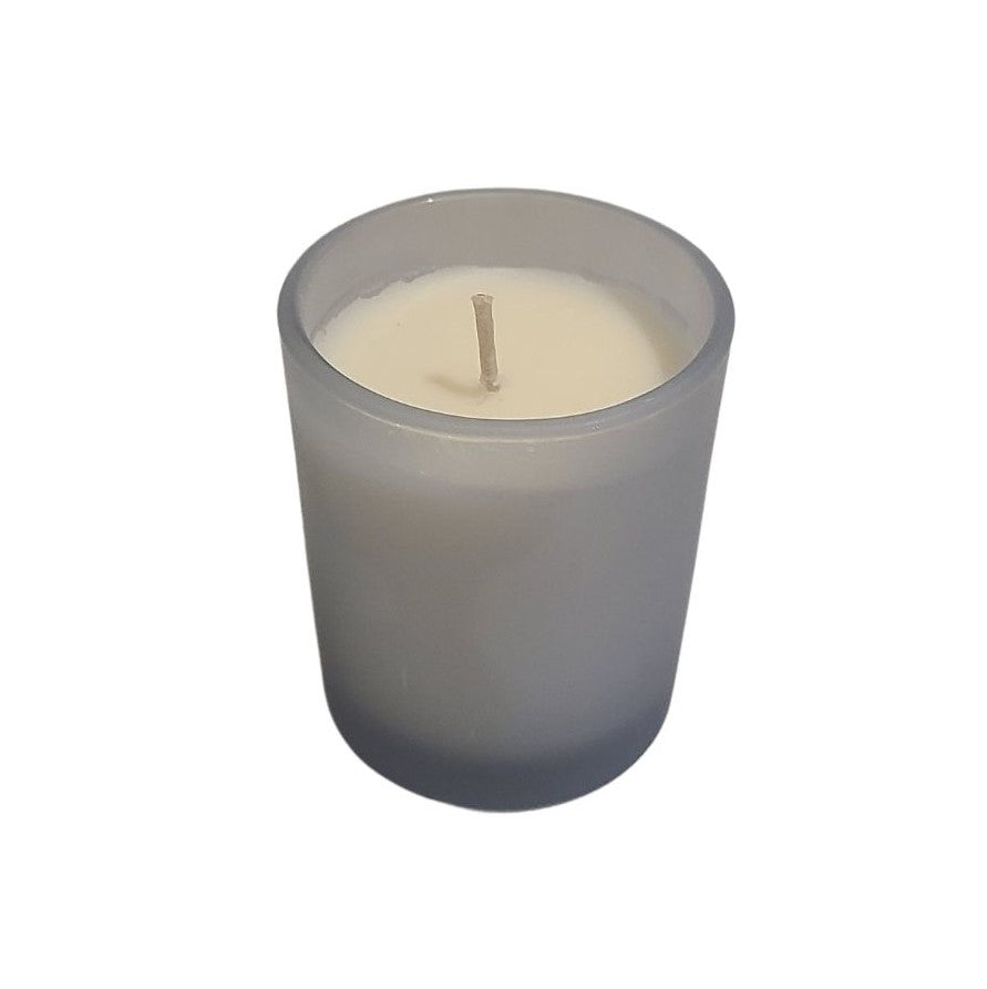 This simple yet elegant Light Blue Frosted Glass Votive Style Candle is hand-poured and infused with Essential Oils for a beautiful fragrance.  With a fresh scent of Light Florals.  Perfect to add to any gift.   3