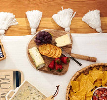 Load image into Gallery viewer, Situational Picture:  with Mango Wood Paddle Serving set on a table with cheese an crackers.
