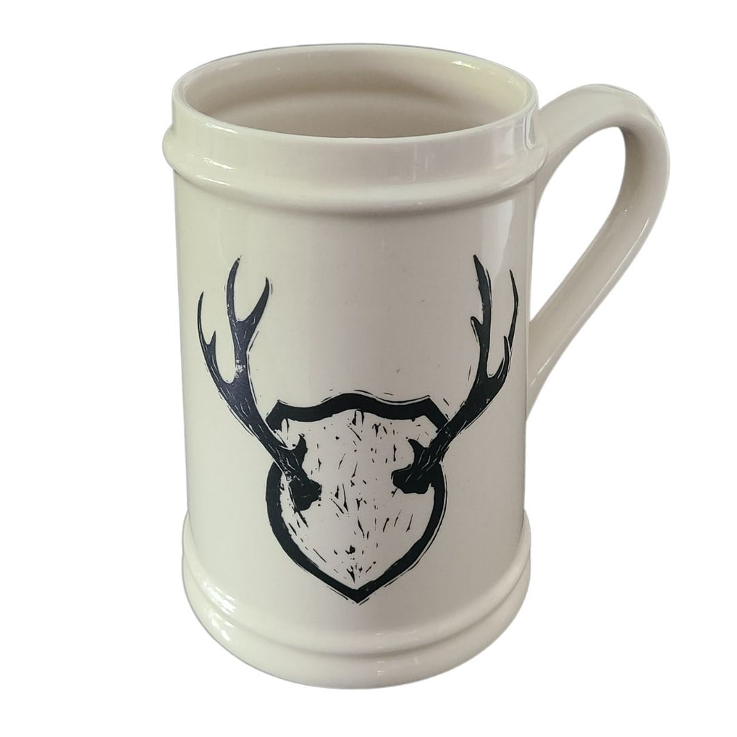 Add to your drinkware collection with these unique beige ceramic beer steins.  Perfect for entertaining on the patio or cottage deck, or chilling in front of the tv.  Pair them with your favourite bottle for a great Father's Day, Birthday or Just Because gift.  3 styles to choose from.  Antlers. Capacity:  18oz  Material:  Ceramic