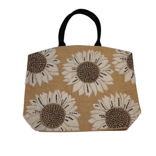 Make a statement this summer on daytime trips or holiday adventures with our beautiful burlap beach tote.  This spacious bag has ample room for all of your essentials.  Styled with hand-woven terrycloth sunflower motifs, this beach bag provides functionality while serving a fashionable look to passers by.  This summer beach tote is a must have to venture off to the beach, cottage, boat cruise, picnic or weekend getaway in style!  Material: Burlap  Dimensions: W21