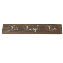 Load image into Gallery viewer, This farmhouse style painted wood plaque with printed &quot;Live Laugh Love&quot; sentiment is the perfect adornment for any home.  Hang it or set it on any surface in your foyer, kitchen, familyroom or hallway so everyone can see it.    Makes a great hostess, mother&#39;s day or just because gift too.  Size: 11&quot; x 2&quot; x 0.5&quot;  Material: Pine wood
