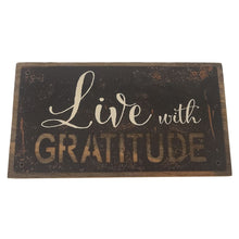 Load image into Gallery viewer, This rustic style painted iron on a wood plaque with inspirational printed &quot;Live With Gratitude&quot; sentiment is the perfect adornment for any home.  Hang it or set it on any surface in your foyer, kitchen, familyroom or hallway so everyone can see it.  Makes a great hostess, mother&#39;s day or just because gift too.  Size: 7&quot; x 4&quot; x 1.5&quot;  Material: Pine wood/Iron
