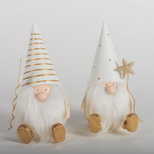 Load image into Gallery viewer, These guy can create magic!  Make your holiday decor sparkle and shine with these adorable gold and white metal vintage style santa gnomes.  2 Styles to choose from:  Star Santa Gnome Tree Santa Gnome Makes a great Teacher, hostess, or stocking stuffer gift.  Size:  4 × 3.5 × 7&quot; each
