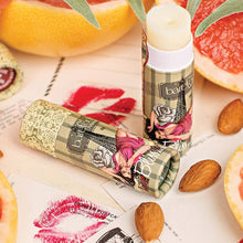 Load image into Gallery viewer, This Barefoot Venus Ruby Red Lip Balm with moisturizing Mango Butter is chock full of Vitamin A, and deeply nourishing Shea Butter bursting with Vitamins A, C and E.  The Meadowfoam Oil serves as a natural SPF. 100% natural Lip Bliss.  Pairs perfectly with our other bath and body products and makes an beautiful addition to any gift set.  Made With: Mango Seed Butter Shea Butter Meadowfoam Seed Oil  Grape Seed Oil Size:  8 g  Does not contain: Parabens, Propylene Glycol, Mineral Oil, Synthetic Colour
