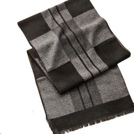 Soft and sophisticated, this sleek accessory, in a blended yarn creates a cozy soft fabric to pair with your winter attire.  This grey and black patterned scarf is finished with a frayed hem.  Materials: 60% Viscose, 40% Polyester