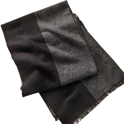 Soft and sophisticated, this sleek accessory, in a blended yarn creates a cozy soft fabric to pair with your winter attire.  This grey and black patterned scarf is finished with a frayed hem.  Materials: 60% Viscose, 40% Polyester