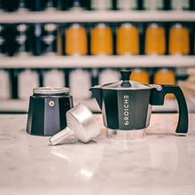 Load image into Gallery viewer, This Milano espresso machine is an elegant black and is made from food safe aluminium with a heat resistant mahogany dip handle and knob, and a non-toxic silicon gasket seal. Medium-fine coffee grounds should be used with the espresso pot.
