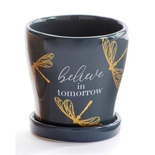 Load image into Gallery viewer, Take your potted plants to the next level with this mini planter styled with an inspirational sentiment and gold accents.  Stunning colours to accent your home decor.  Add a beautiful succulent plant to make a great gift!  Complete with drainage hole and removable tray.  Perfect for Mother&#39;s Day, Birthdays, House Warming or Just Because.  Available in 3 designs. Blue Grey Dragonfly/BELIEVE IN TOMORROW.  Size:  3&quot; D  Material:  Ceramic
