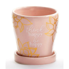 Load image into Gallery viewer, Take your potted plants to the next level with this mini planter styled with an inspirational sentiment and gold accents.  Stunning colours to accent your home decor.  Add a beautiful succulent plant to make a great gift!  Complete with drainage hole and removable tray.  Perfect for Mother&#39;s Day, Birthdays, House Warming or Just Because.  Available in 3 designs. Pink Lotus Flower/THINK HAPPY BE HAPPY . Size:  3&quot; D  Material:  Ceramic
